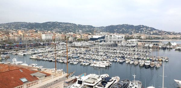 High angle view of townscape and harbor against sky