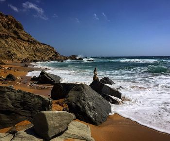 Scenic view of sea against blue sky