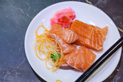 High angle view of fish in plate on table