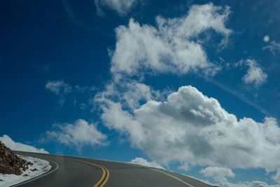 Low angle view of road against blue sky