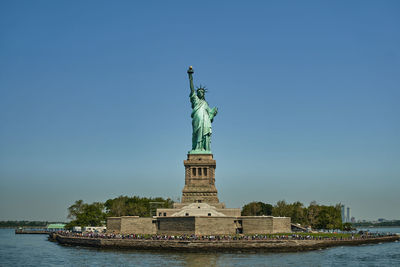Statue of liberty against clear blue sky