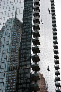 Low angle view of modern buildings against sky