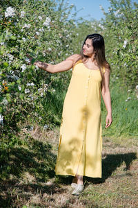 Young woman standing on field