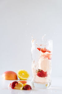 Close-up of fruits against white background