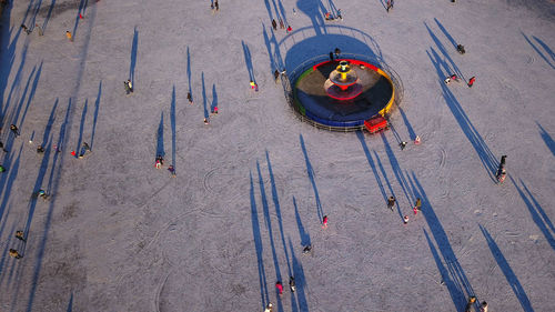 High angle view of people on frozen lake