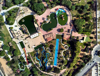 High angle view of graffiti on field by buildings in city