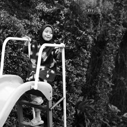 High angle view of young woman standing on field