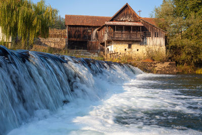 An old house on the cascades of the dobra river in croatia