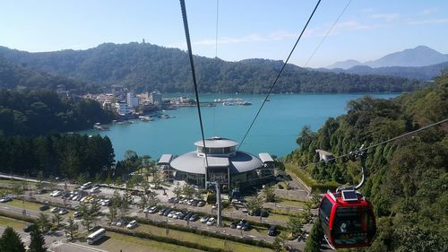 High angle view of ski lift over sea against sky