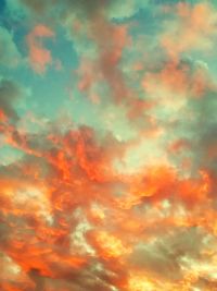 Low angle view of orange cloudy sky