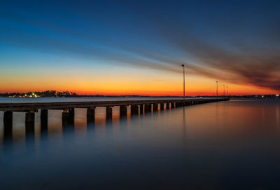 Scenic view of bridge against sky during sunset