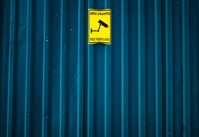 Full frame shot of blue sign on wall