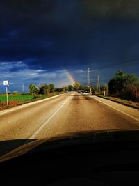 Country road seen through car windshield