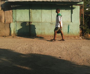 Full length of woman standing by railing