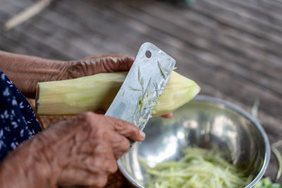 Midsection of person preparing food