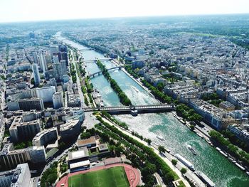 High angle view of river amidst buildings in city