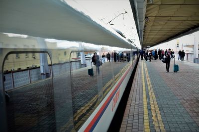 People waiting at railroad station platform