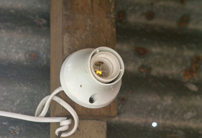 High angle view of telephone booth against wall