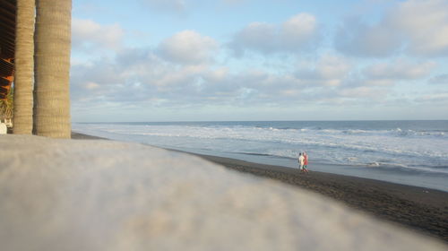 Scenic view of sea against cloudy sky