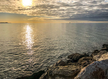 Scenic view of sea against sky during sunset