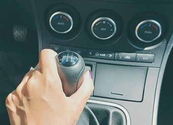 Close-up of hand holding car