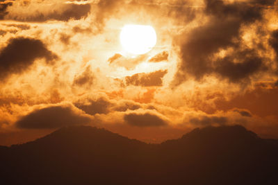 Low angle view of dramatic sky during sunset