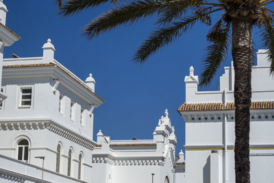 Low angle view of building against blue sky