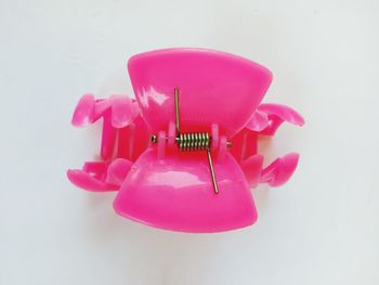Close-up of pink toy against white background