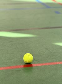 Close-up of tennis ball on playing field