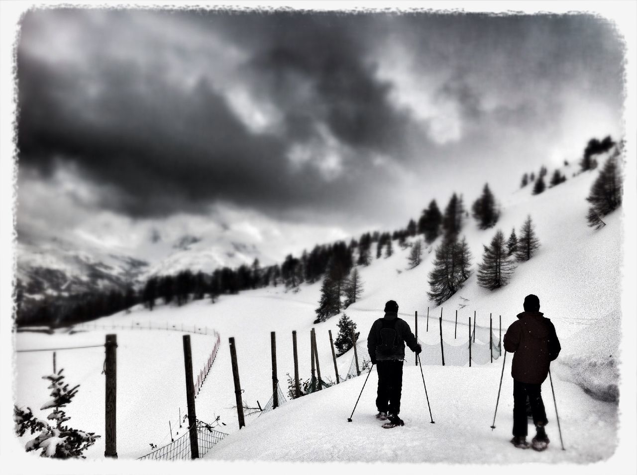 transfer print, sky, men, lifestyles, full length, cloud - sky, auto post production filter, mountain, leisure activity, weather, rear view, walking, standing, water, railing, cloudy, person