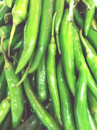 Full frame shot of green chili peppers for sale in market