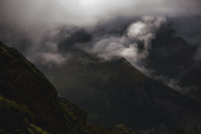 Low angle view of mountain range against sky