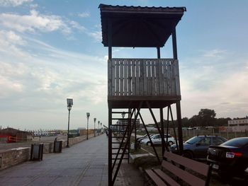 Lifeguard hut in city against sky