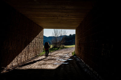 A young girl is walking on the camino frances to puente la reina