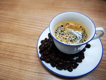 High angle view of coffee cup on table