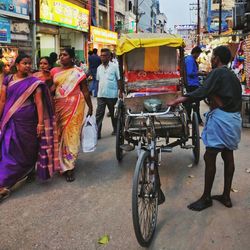 People on road in city