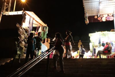 Group of people at music concert at night