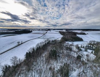 Scenic view of frozen lake against sky