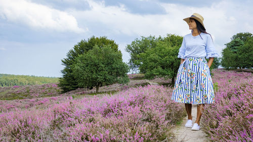 Young woman standing on field