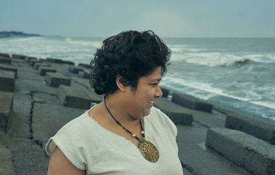 An indian girl enjoying beauty of seascape at shankarpur, digha in west bengal.