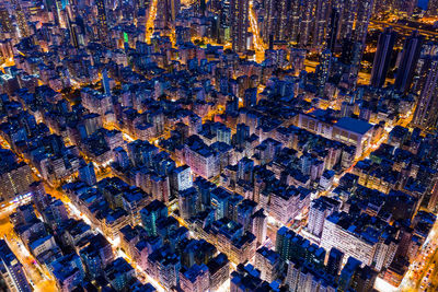 High angle view of illuminated buildings in city at night