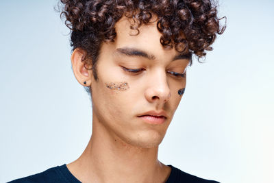 Close-up portrait of serious young man