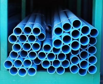 Close-up of stack of pipes