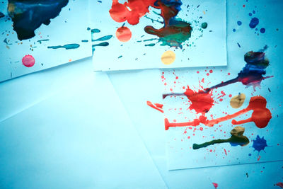 High angle view of multi colored paper on table