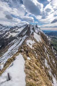 Scenic view of snowcapped mountains against sky