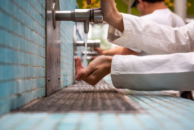 Close-up of man playing the wall