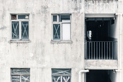 Closed windows of abandoned building