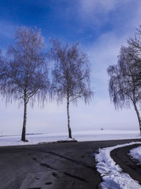 Scenic view of frozen lake against sky during winter