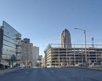 View of city buildings against clear sky