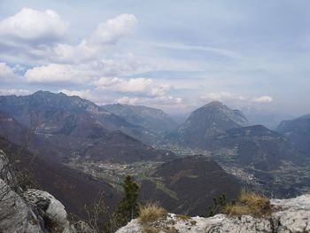 Scenic view of mountains against cloudy sky